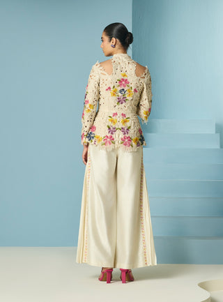 Ivory embroidered pleated pants