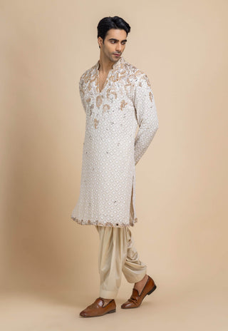 Ivory chikankari kurta and beige salwar