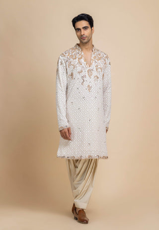 Ivory chikankari kurta and beige salwar