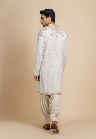 Ivory chikankari kurta and beige salwar