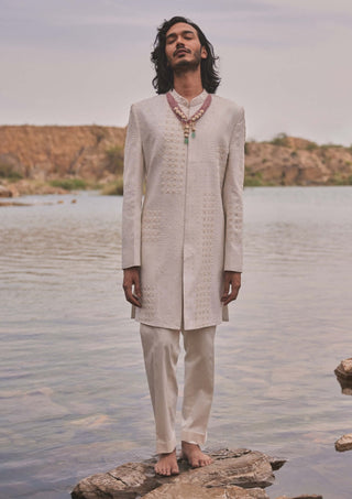 Adhir Ivory Sherwani And Pants by Mishru Men, available on Indiaspopup.com