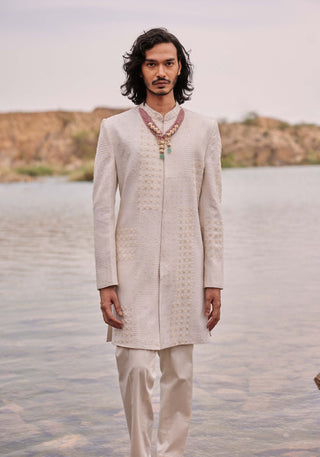 Adhir Ivory Sherwani And Pants by Mishru Men, available on Indiaspopup.com