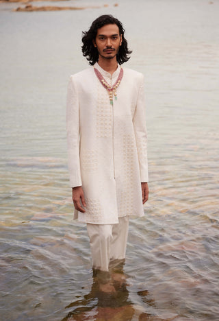 Adhir Ivory Sherwani And Pants by Mishru Men, available on Indiaspopup.com