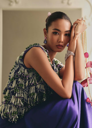 Purple beaded cropped jacket and draped skirt