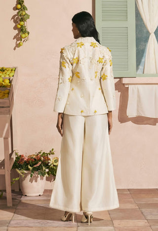 Ivory cutwork flared pants