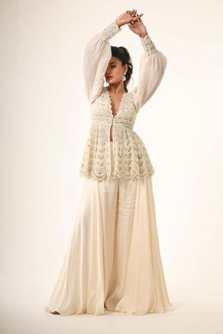 Ivory peplum top and flared pants