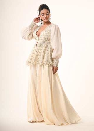 Ivory peplum top and flared pants