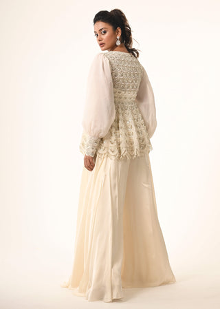 Ivory peplum top and flared pants