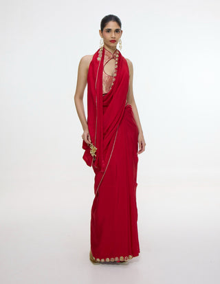 Vermillion sari with gold button detailing