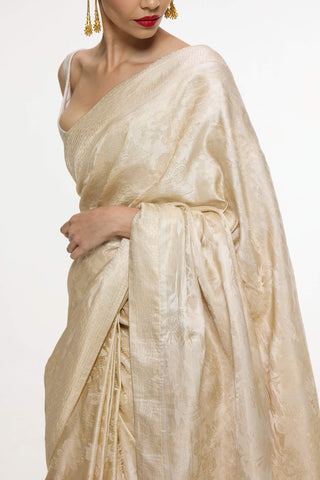 Ivory kadhwa banarasi sari and unstitched blouse