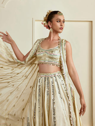 Gold strappy micro-mirror embroidered lehenga and cape