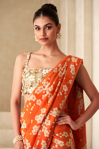 Orange printed sari and embroidered blouse set