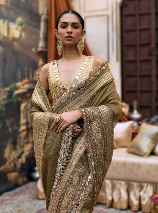 Green tarangini sari and sleeveless mirror blouse