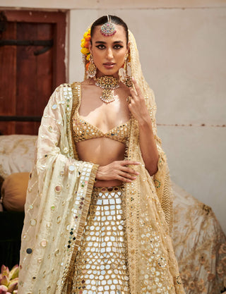 Sheesh Mahal Gold Lehenga Set by Itrh available on Indiaspopup.com