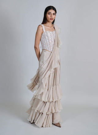 Champagne ivory ruffle sari and corset.