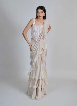 Champagne ivory ruffle sari and corset.