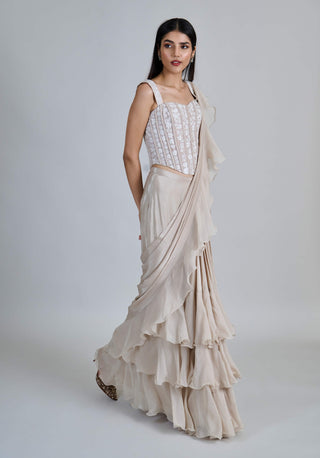 Champagne ivory ruffle sari and corset.