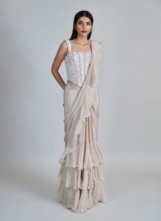 Champagne ivory ruffle sari and corset.