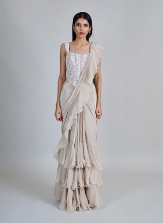 Champagne ivory ruffle sari and corset.