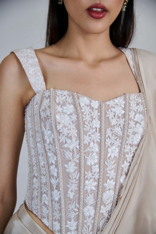 Champagne ivory ruffle sari and corset.
