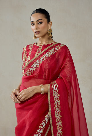 Red organza sari with brocade blouse