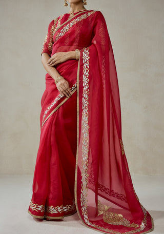 Red organza sari with brocade blouse