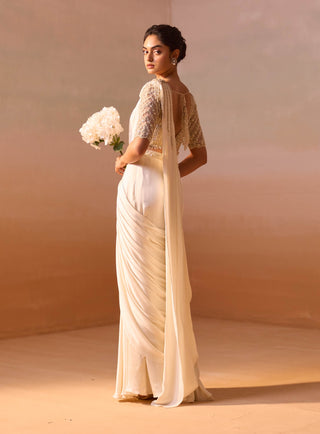 Ivory Satin Draped Sari And Blouse by Nitika Gujral, available on Indiaspopup.com