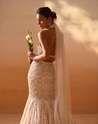 Ivory Fishtailed Skirt And Halter Blouse by Nitika Gujral, available on Indiaspopup.com