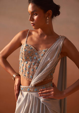 Powder Blue Draped Sari And Blouse by Nitika Gujral, available on Indiaspopup.com