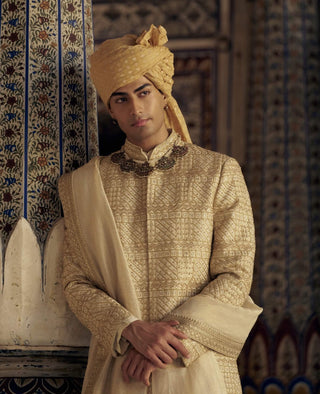 Gold Benarsi Brocade Sherwani Set by Nitika Gujral Men available on Indiaspopup.com