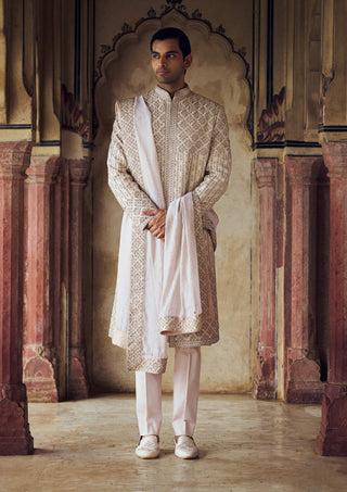 Blush Raw Silk Sherwani Set by Nitika Gujral Men available on Indiaspopup.com