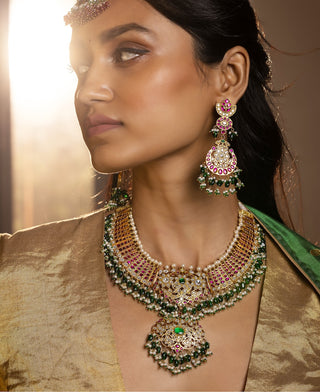 Aishani red and green kundan necklace set