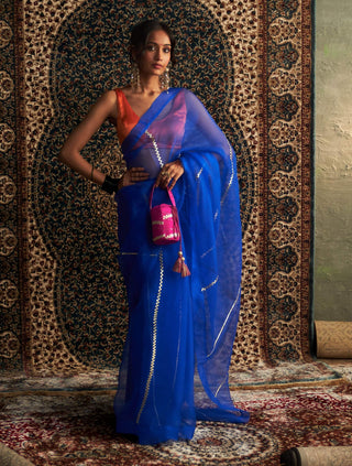 Blue embroidered organza sari and saffron blouse