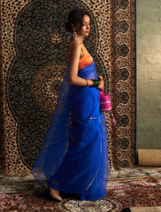 Blue embroidered organza sari and saffron blouse