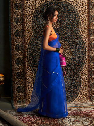 Blue embroidered organza sari and saffron blouse