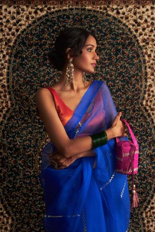 Blue embroidered organza sari and saffron blouse