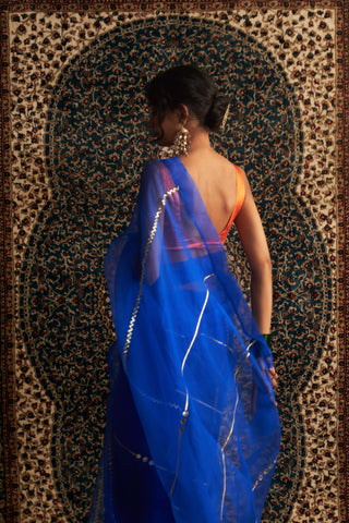 Blue embroidered organza sari and saffron blouse