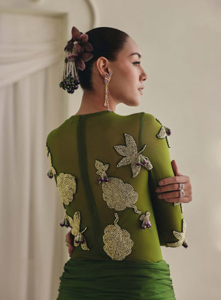 Sheer olive bodysuit and draped skirt