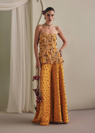 Yellow strapless top and wide palazzos