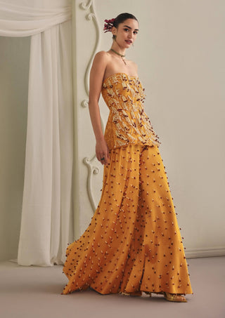 Yellow strapless top and wide palazzos
