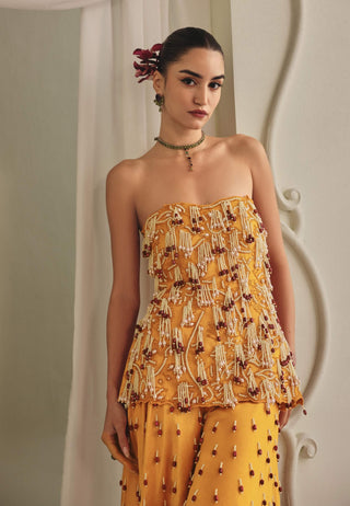 Yellow strapless top and wide palazzos