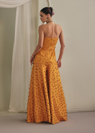Yellow strapless top and wide palazzos