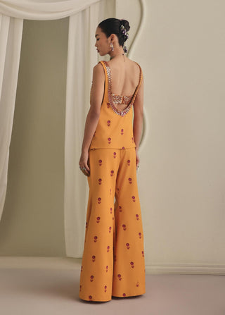Mustard embellished bustier, bell-bottom pants and koti