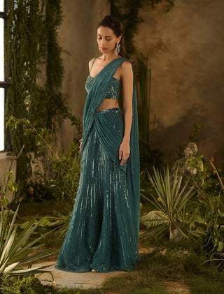 Opulent olive green draped sari and blouse