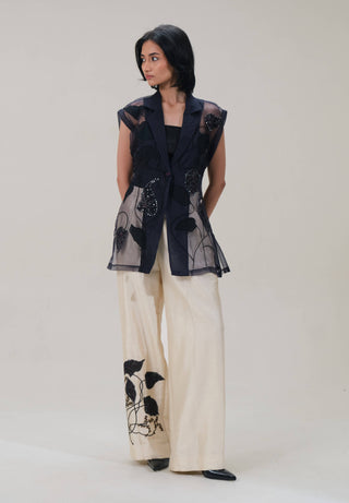 Lumière black shirt and beige pants