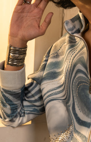Printed wave bomber with denims