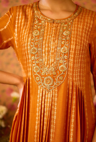 Amber Glow Yellow Mustard Kurta And Flared Pant Set by Shyam Narayan Prasad available on Indiaspopup.com