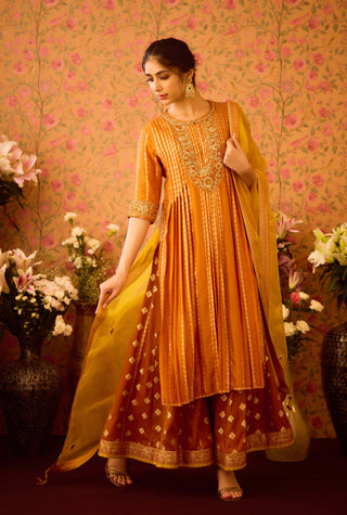 Amber Glow Yellow Mustard Kurta And Flared Pant Set by Shyam Narayan Prasad available on Indiaspopup.com