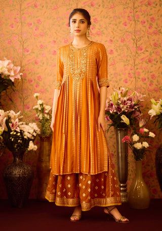 Amber Glow Yellow Mustard Kurta And Flared Pant Set by Shyam Narayan Prasad available on Indiaspopup.com