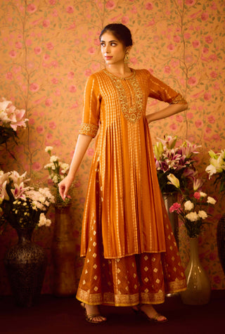 Amber Glow Yellow Mustard Kurta And Flared Pant Set by Shyam Narayan Prasad available on Indiaspopup.com